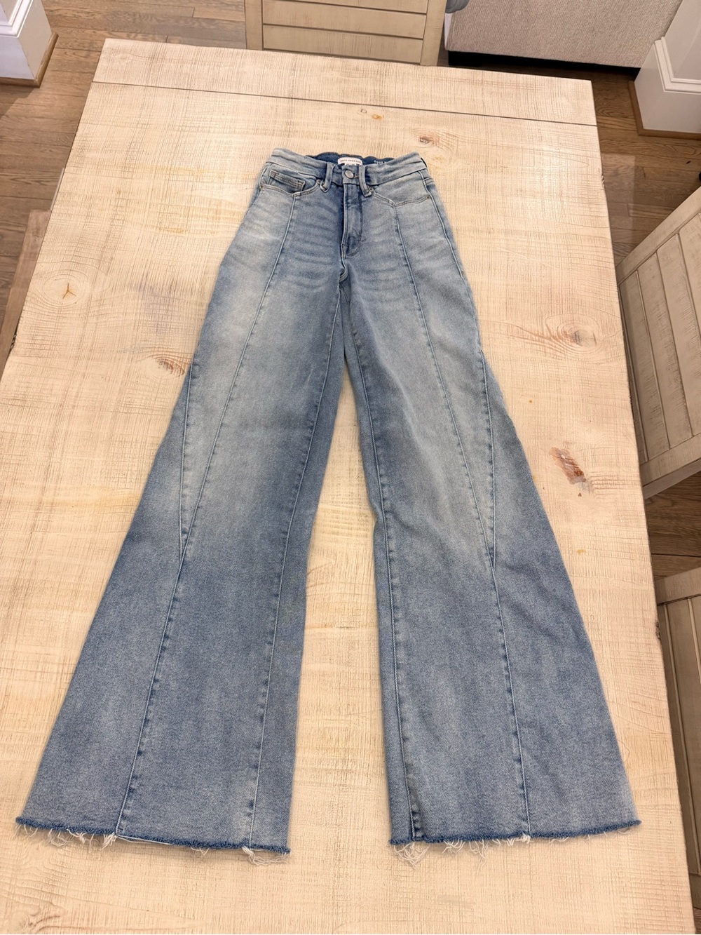 Good American Light Blue Flare Jeans with Raw Hem